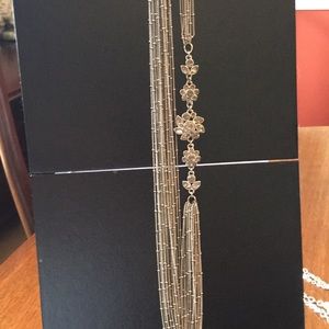 Silver tone multi strand necklace with crystals